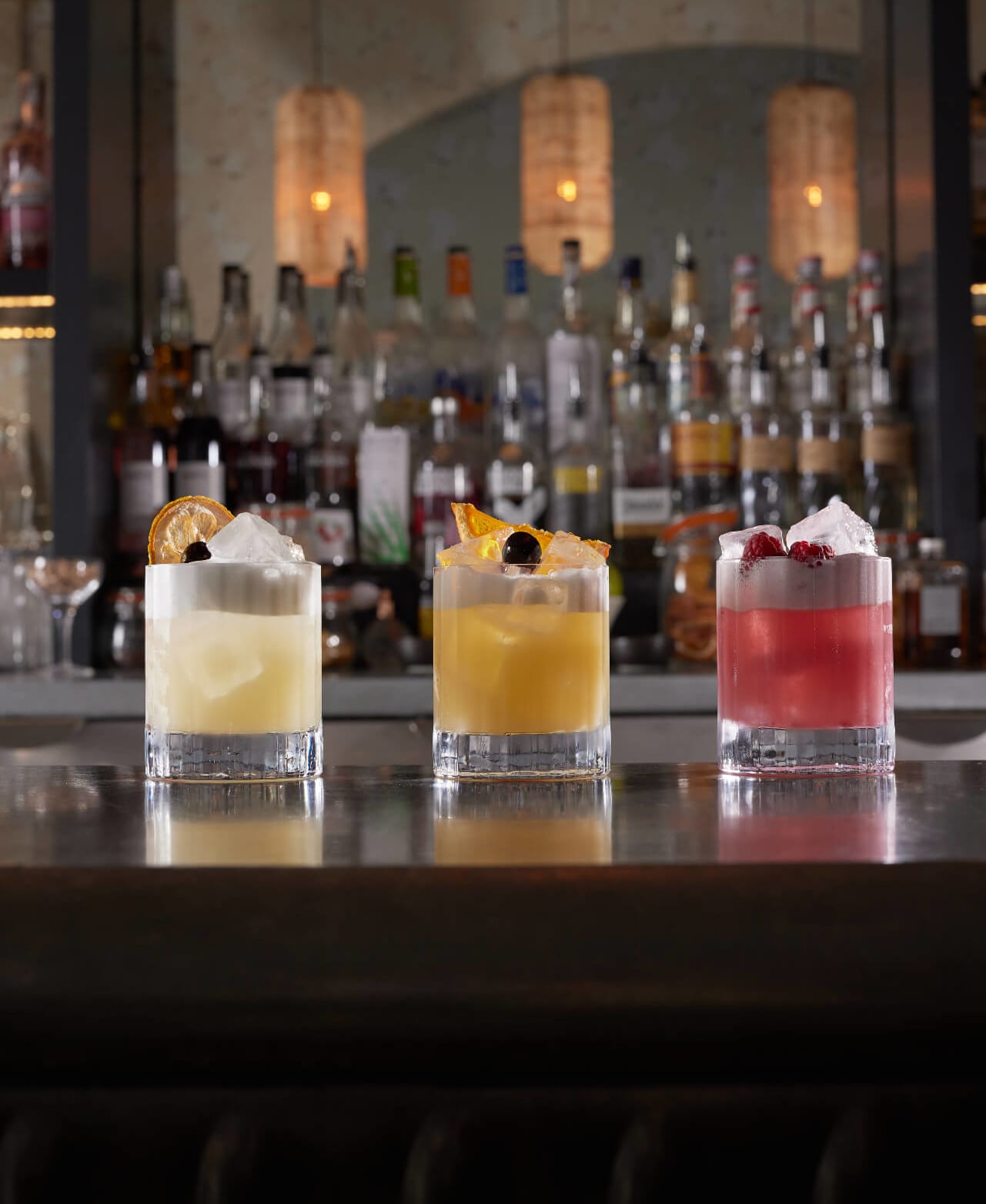 Three cocktails on the marble bar