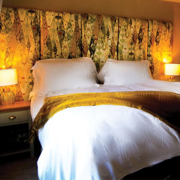 A double bedroom with a golden headboard