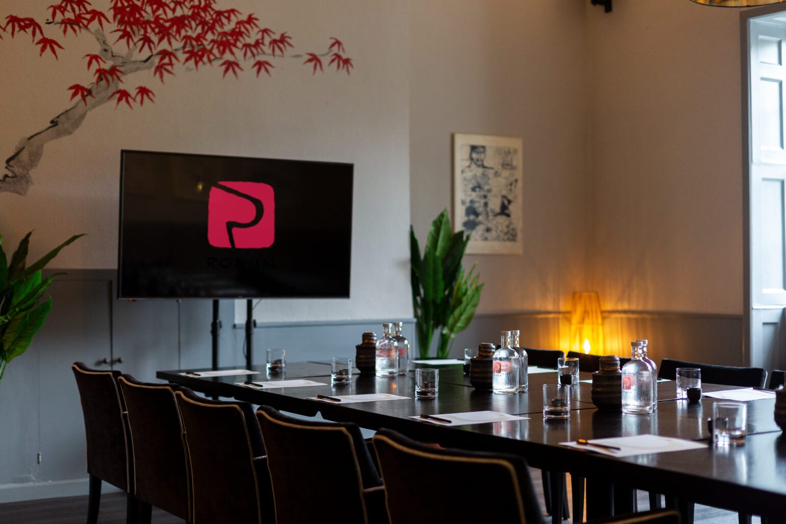 The Kanagaki Suite's long table beside the wall-set fire