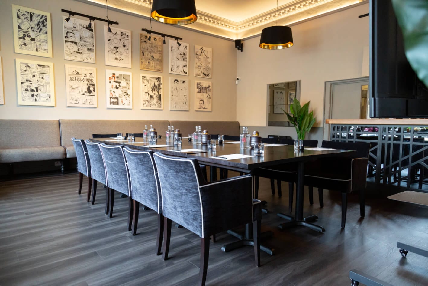 The suite's print wall above a laid table