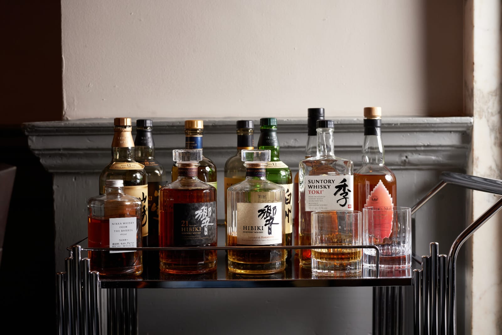 Japanese whiskies lined along the back bar